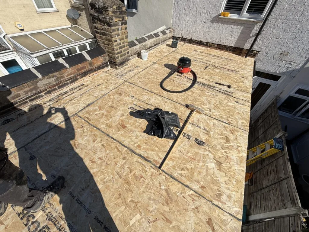 Flat roof repairing work, Custom House, E16 (before)